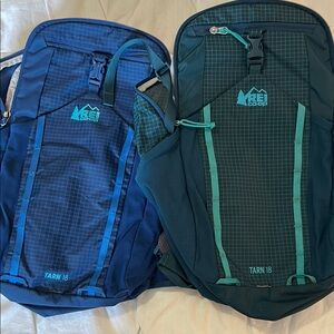 Two REI Tarn 18 backpacks